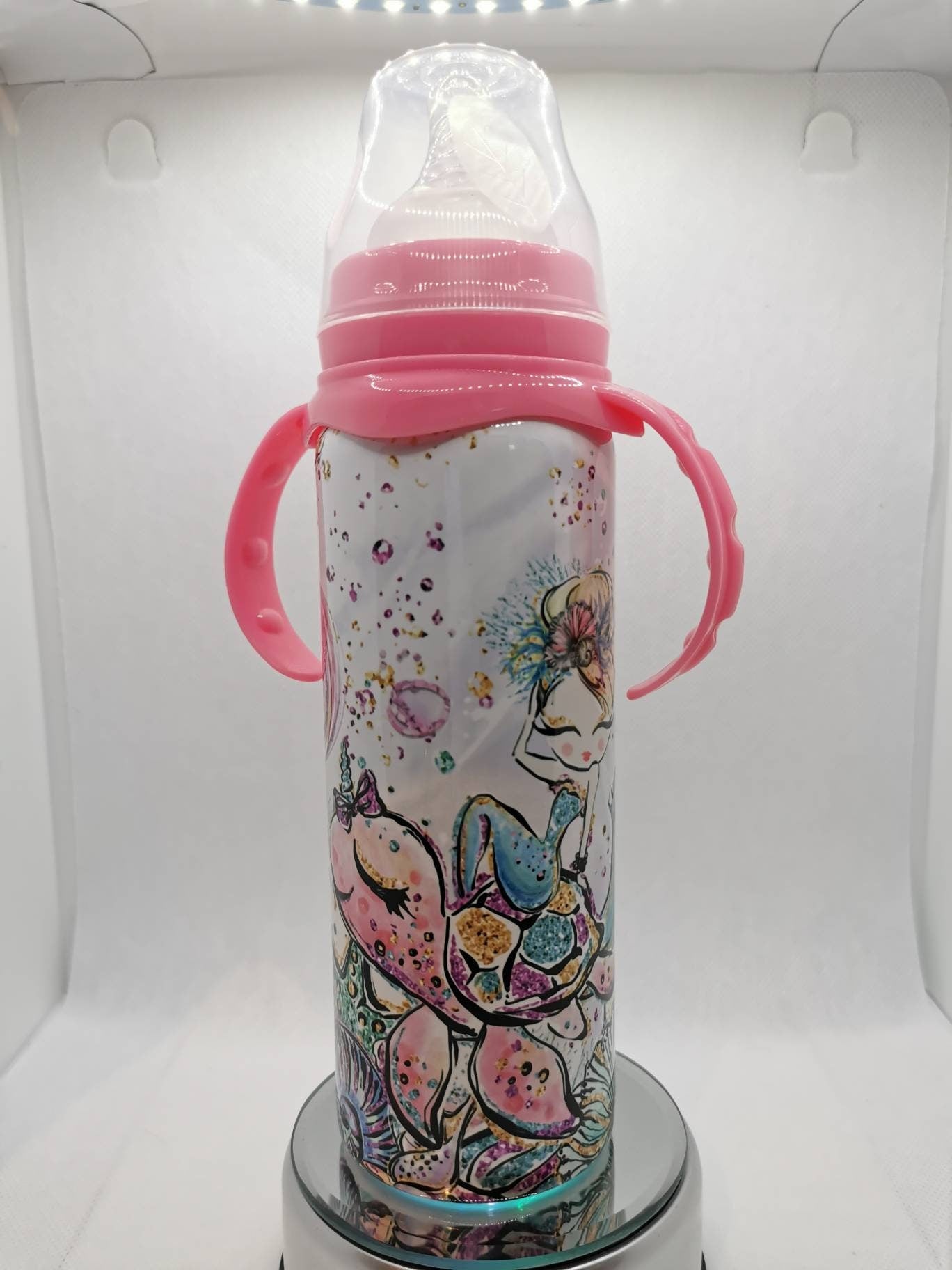 Pink bottle with weighted straw