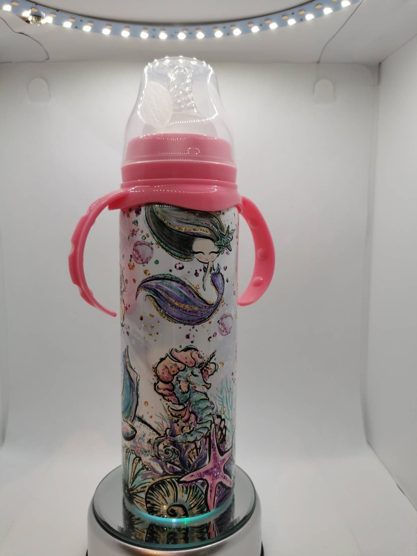 Pink bottle with weighted straw